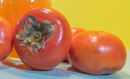 Persimmon fruits and juice. Fiber source. Fruit that favors weight loss. Diospyrus kaki L. The...