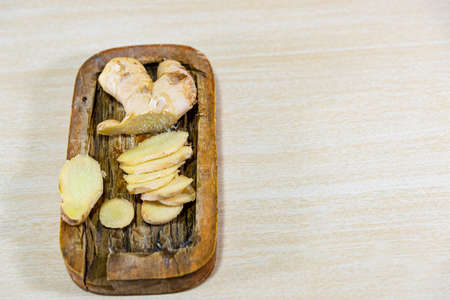 Ginger root. Ginger has a spicy flavor and can be used in both savory and sweet dishes and in several forms: fresh, dry, preserved or crystallized.の写真素材