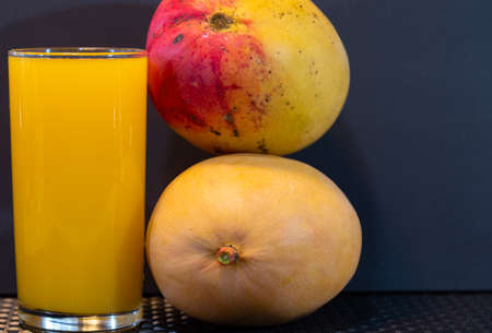 Mango juice. Fresh fruits. Exotic fruit and rich in fiber. Detox and antioxidant drink. Natural...