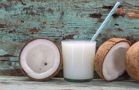 Glass of fresh coconut milk. It is rich in good saturated fat, which is quickly digested and transformed into energy. Nutrient-rich alimenti, used for medicinal, food and agro-industrial purposes.の写真素材