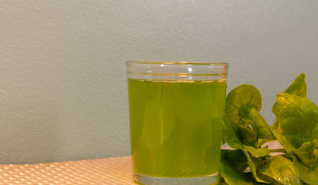 Green juice. Detox juice. Slimming drink. Liquid diet of spinach leaves. Low calorie drink. Healthy eating. Natural lifestyle.の写真素材