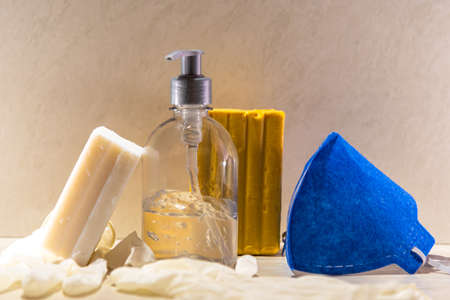 Hygiene kit. Bar soap, alcohol gel, surgical mask and disposable gloves. Prevention and fight against covid-19. Preventive medicine. Personal health.の写真素材