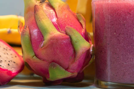 Pitaya juice and fresh fruits. Pitaya juice is rich in vitamins and is great for health. Detox and...