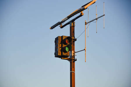 Railway traffic light. data transmission antenna. sky on blue background. transport infrastructure....