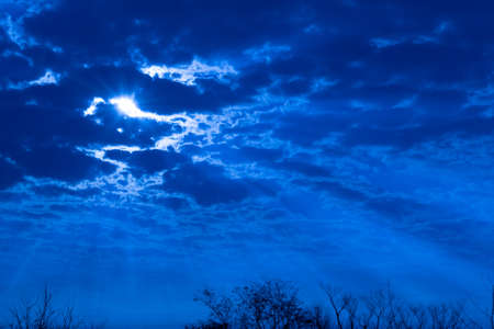Evening in the region of the Pampa Biome. Late afternoon in southern Brazil. Dramatic sky. Colors and hues. Setting sun and late afternoon. Poetry and magic. Feelings of peace and infinity. Peace and calm. Rural.の写真素材