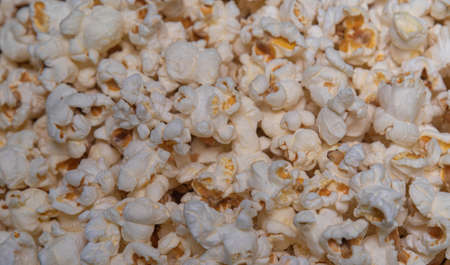 Popped popcorn. Popcorn ready for consumption. human food. Kit for consumption in the cinema.の写真素材