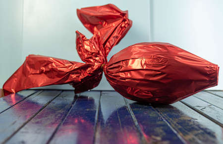 Chocolate egg packed for gift on Easter day. Christian holiday. Candy and mischief. Easter egg. Gift for children and adults. Bunny gifts in the Christian tradition.の写真素材