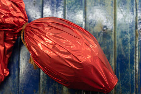 Chocolate egg packed for gift on Easter day. Christian holiday. Candy and mischief. Easter egg. Gift...