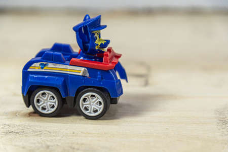 Old toy car on the wooden background. Toy miniatures. Retro car. Child's play. Collection item....