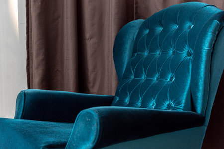 Blue psychology armchair in clinical setting. Psychology office. Internal environment. Decorative item. Sofa for office. Classic furniture.の写真素材