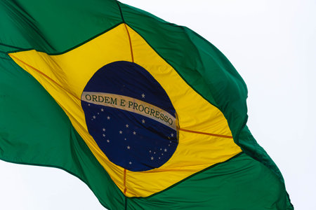 Flag of the federative republic of Brazil. Brazilian official flag. National symbol. Green and yellow flag. Pennant hoisted in the wind. Pavilion. Civic symbol. National symbol of Brazil.の写真素材