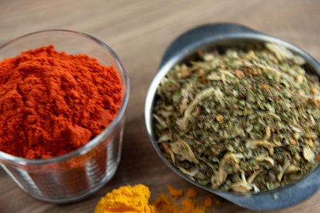 Ground red culinary condiment made from annatto (Bixa orellana). Paprika. Mild and slightly sweet spice, consumed in meats and sauces. Essential spices.の写真素材