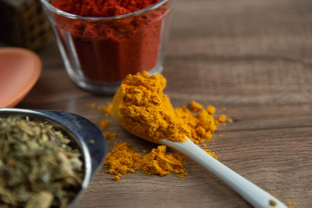 Ground red culinary condiment made from annatto (Bixa orellana). Paprika. Mild and slightly sweet spice, consumed in meats and sauces. Essential spices.の写真素材