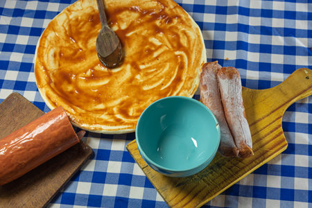 Ingredients and utensils for preparing homemade pizza. Pizza with tomato sauce. Italian cuisine. Amateur cuisine. Food. Typical food preparation.の写真素材