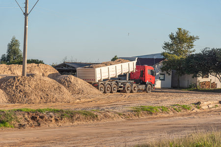 Truck unloading sand at a construction site in the countryside.の写真素材