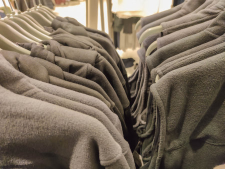 clothes on hangers in a store, closeup of photoの写真素材