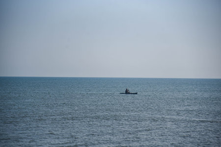 Man kayaking in the seaの写真素材