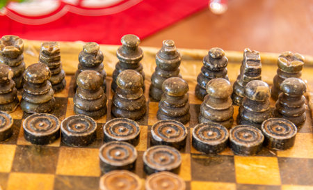 Chess pieces on a stone board.