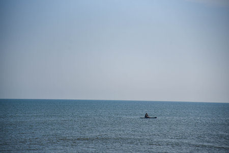 Man kayaking in the seaの写真素材