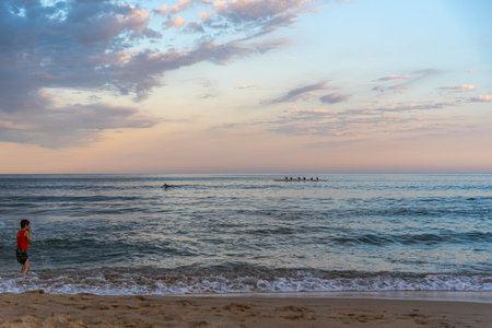 Rowing team on Gamboa beach, Santa Catarina, Brazil