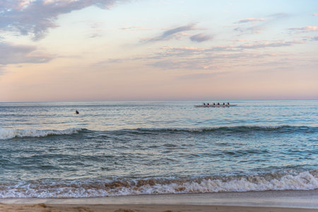 Rowing team on Gamboa beach, Santa Catarina, Brazil