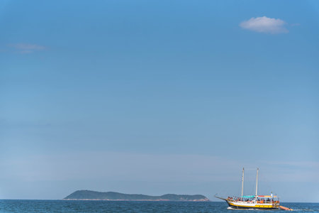 Tourist boat on the coast of Gamboa beach, Santa Catarina, Brazil.NEF.