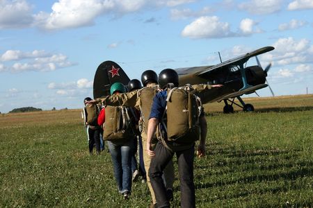 The young parachutists went to aircraft.の写真素材