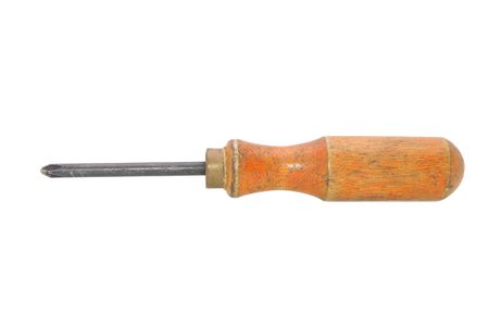 an old screwdriver with a wooden handle is on a white backgroundの写真素材