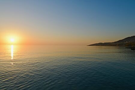 late sunset over the sea on the coast of the bay