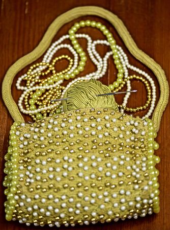 handmade knitted green bag embroidered with beadsの写真素材