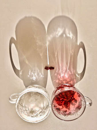 cups with hot and cold drinks with shadows