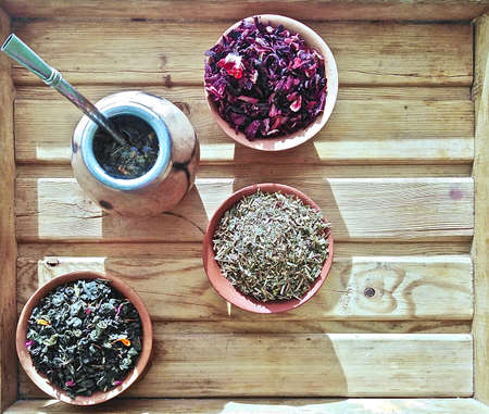 unbrewed tea and calabash on a wooden tray by the windowの写真素材