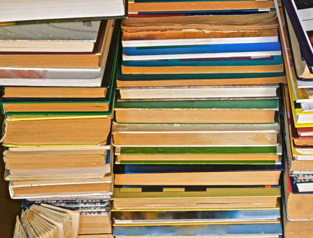 old variety of books that are rotated protipolozhnymi-binding parties lined uneven stacksの写真素材