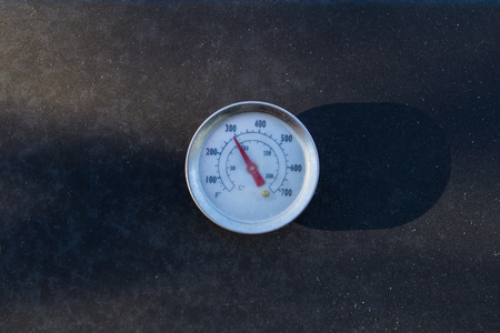 black barbecue thermometer in the sun lightの写真素材