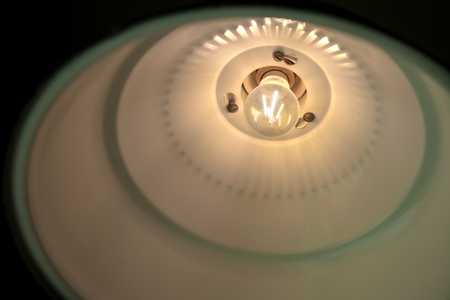 modern pendant light with vintage light bulb close-upの写真素材