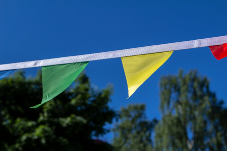 Colorful triangular flags of decorated celebrate outdoor partyの写真素材