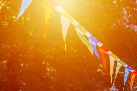 Colorful triangular flags of decorated celebrate outdoor partyの写真素材