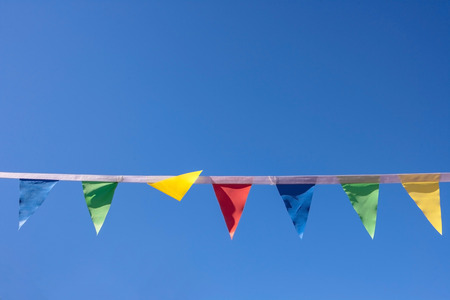 Colorful triangular flags of decorated celebrate outdoor partyの写真素材