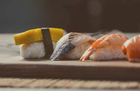 Mix sushi on wood dish, tuna, salmon, sea bass, sweet egg, shrimp sushi, Japanese foodの写真素材