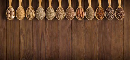 collection  Indian spices in spoons  over wooden table backgroundの写真素材