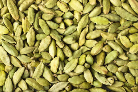 texture of cardamom seeds close-up, spice or seasoning as backgroundの写真素材