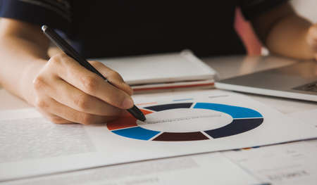 Businessman analyzing investment charts with laptop. Accounting and Business conceptの写真素材