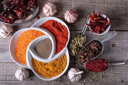 Variety of spices and herbs on the kitchen tableの写真素材