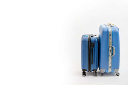Two blue suitcase isolated on white background. Blue suitcase.の写真素材