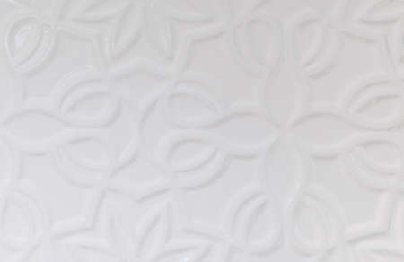 white wall background with various forms of ornamentationの写真素材