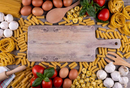 pasta, vegetables, eggs, on wooden boardの写真素材