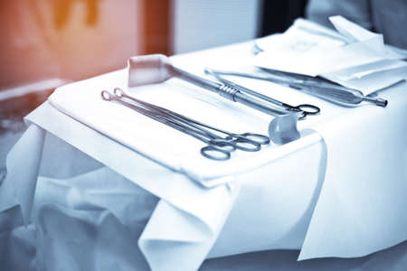 Surgery instrument and tools set on white sterile fabric in operating room at hospital. Medical and...