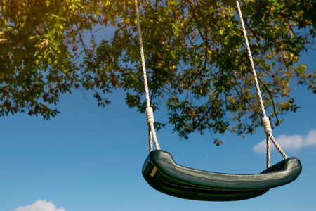 swing against the blue sky close-upの写真素材