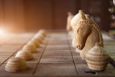 Wooden Thai chess on wooden board. Strategy and hobby concept. Business and leisure themeの写真素材