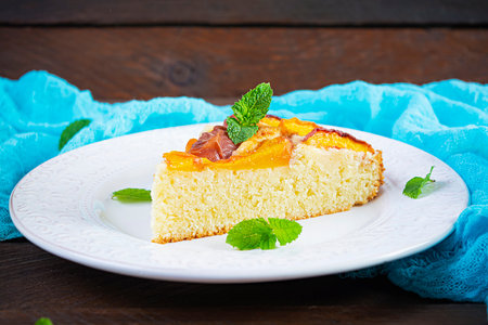 Delicious homemade peach pie on wooden backgroundの写真素材